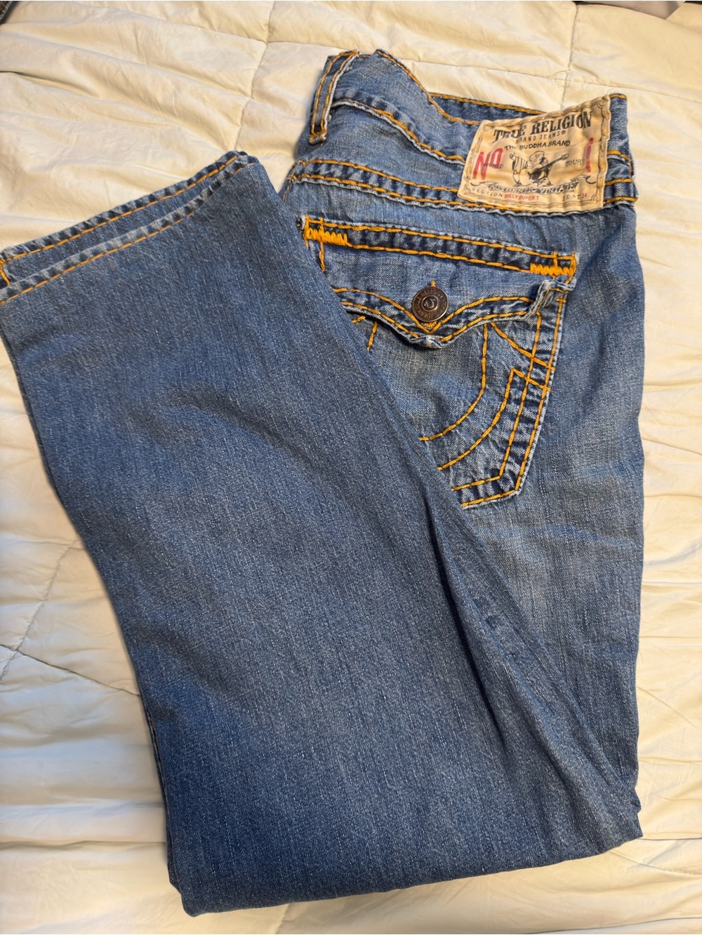 True Religion Blue Denim Jeans with Yellow Contrast Stitching and Leather Patch